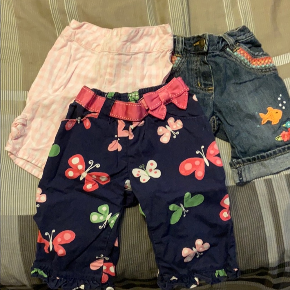 Three pairs of pants with design
